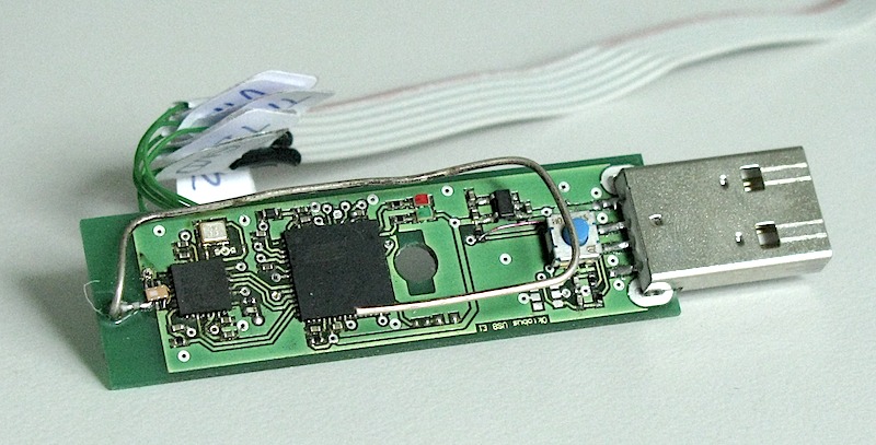 The internals of the USB stick (including JTAG adapter)